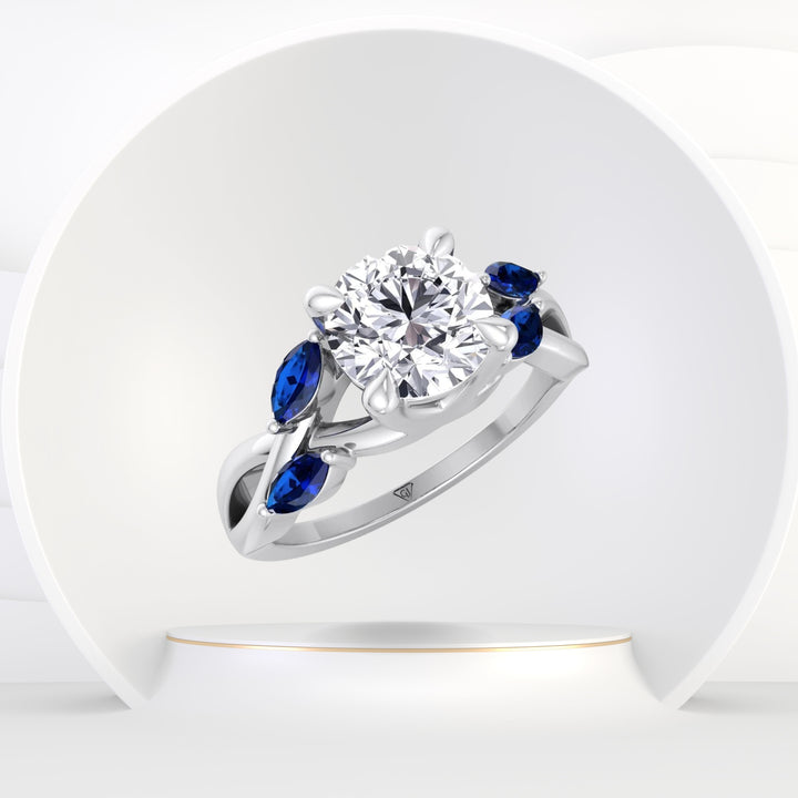 Sfera (2.85CT T.W.) - Round Cut Diamond Engagement Ring with Blue Sapphire Marquise Shape Sidestones - Gem Jewelers Co