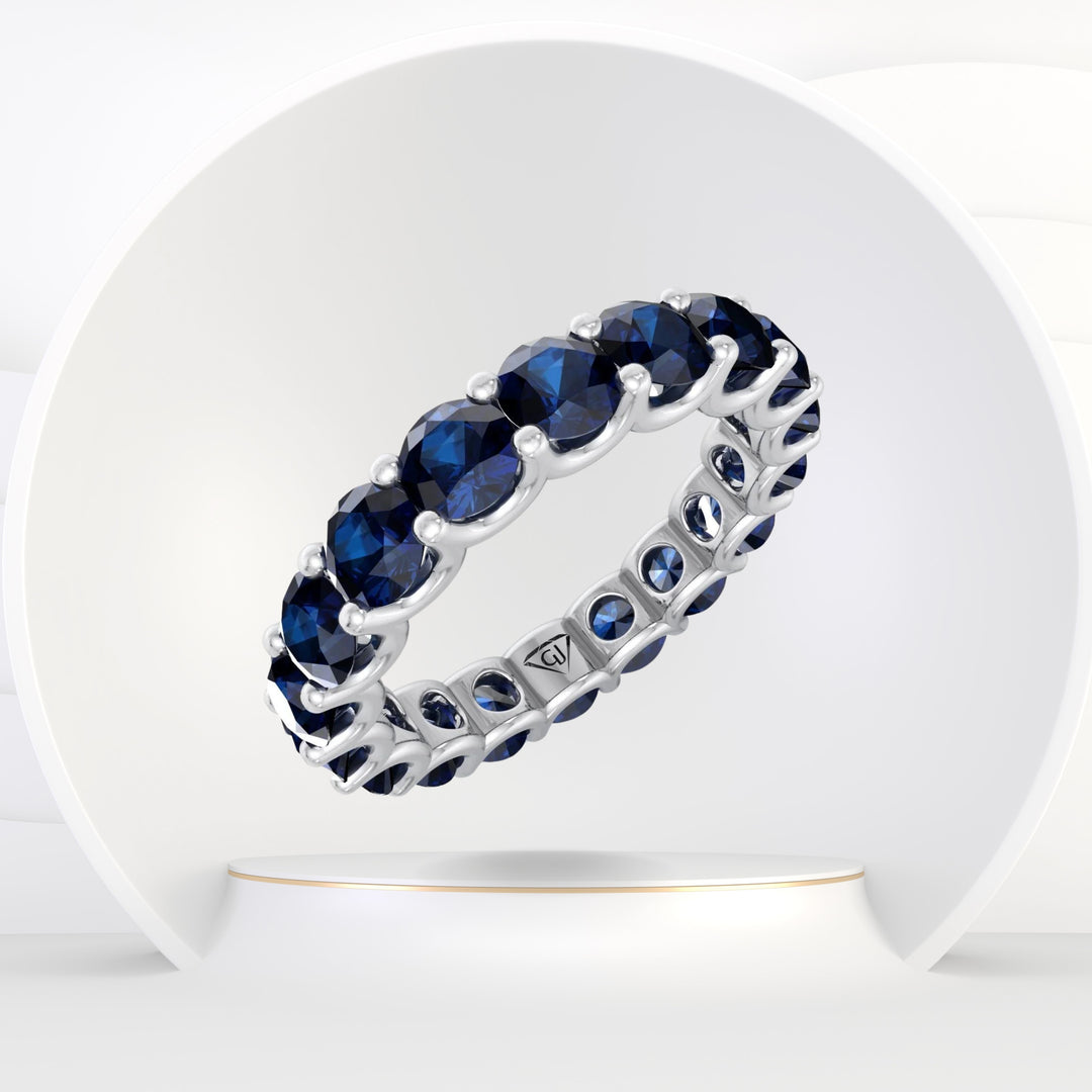 September - Round Cut Blue Sapphire Eternity Band - Gem Jewelers Co