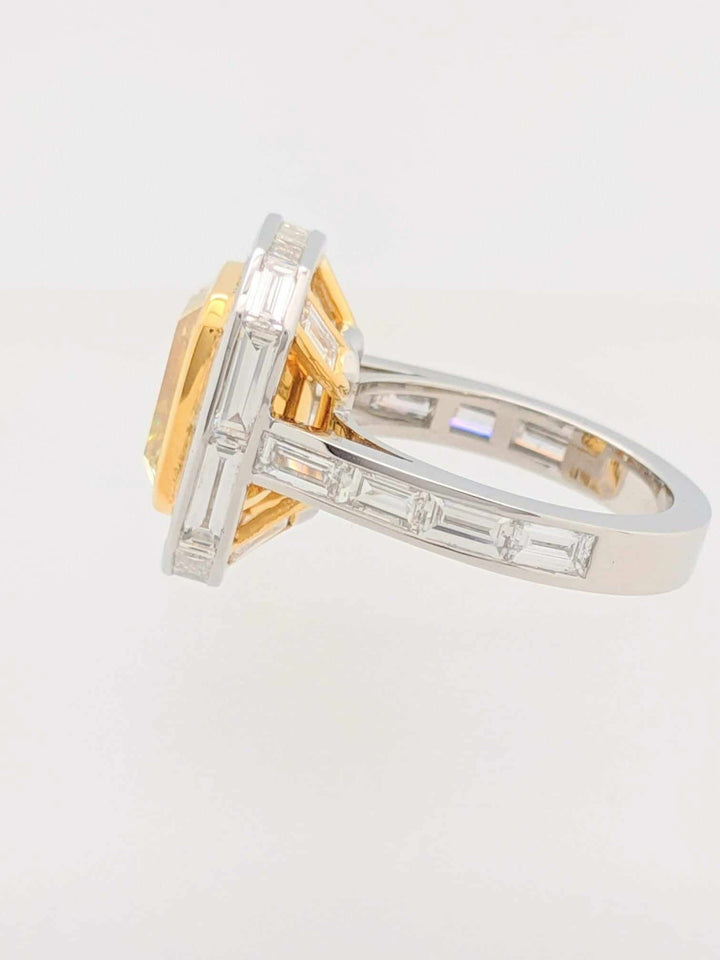 GIA Certified 5.01CT Emerald Cut Fancy Yellow Diamond Center Stone with Baguette Cut Diamond Halo Engagement Ring in Platinum