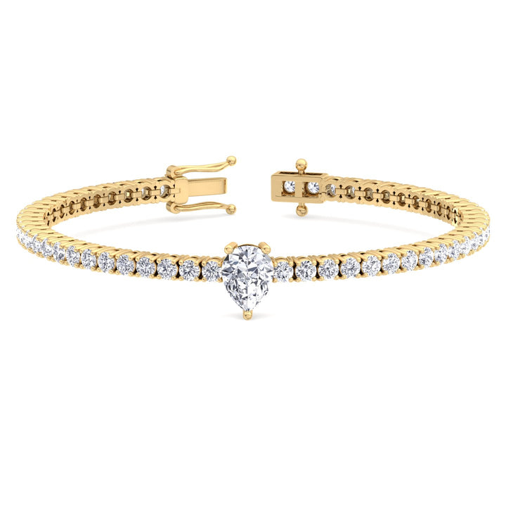 pear-cut-center-stone-diamond-tennis-bracelet-in-solid-yellow-gold