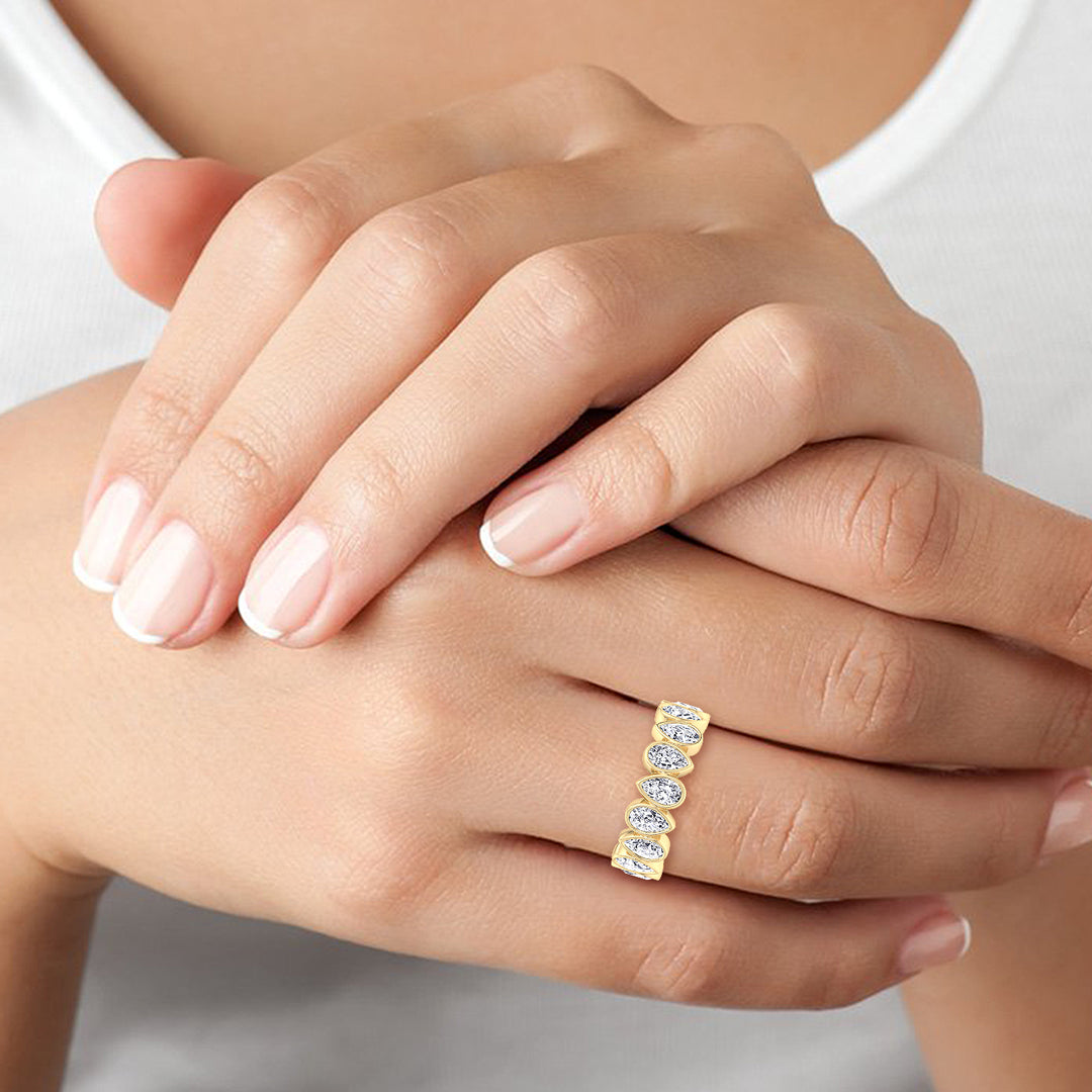 bezel-set-pear-shape-diamond-eternity-band-in-solid-yellow-gold