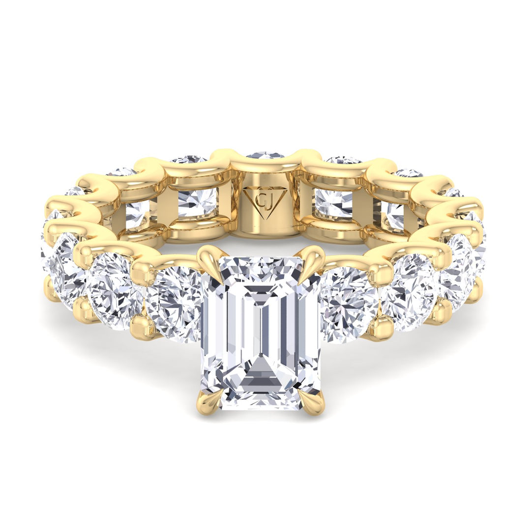 emerald-cut-diamond-eternity-ring-with-round-side-stones-solid-yellow-gold