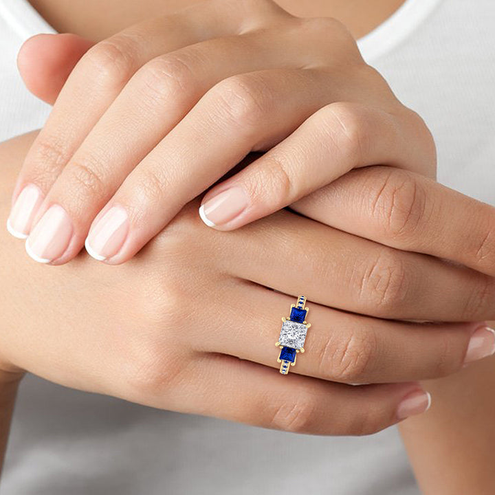 3-20-c-t-w-princess-cut-diamond-engagement-ring-with-blue-sapphire-sidestones-in-solid-yellow-gold