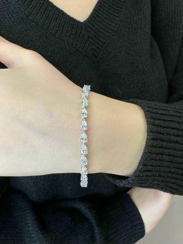 pear-shape-prong-setting-east-to-west-diamond-tennis-bracelet-in-18k-white-gold