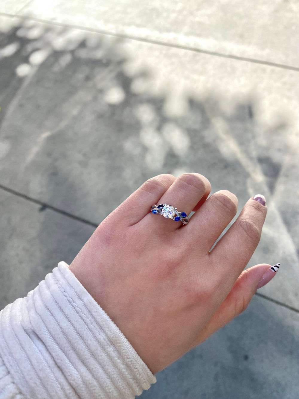 Sfera (2.85CT T.W.) - Round Cut Diamond Engagement Ring with Blue Sapphire Marquise Shape Sidestones - Gem Jewelers Co