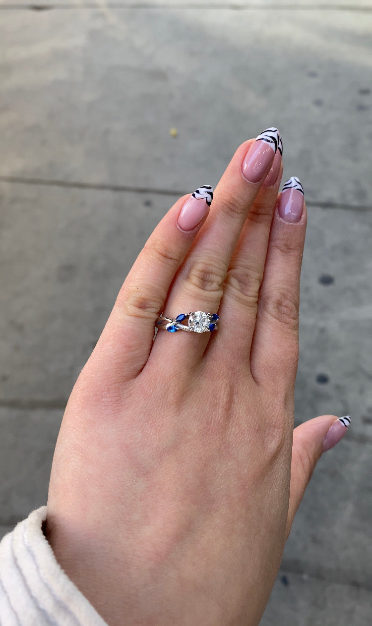 Sfera (2.85CT T.W.) - Round Cut Diamond Engagement Ring with Blue Sapphire Marquise Shape Sidestones - Gem Jewelers Co