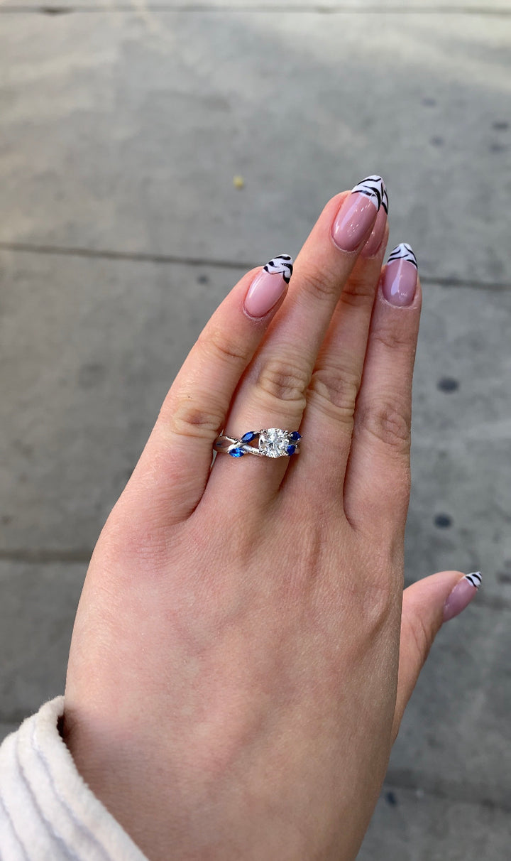 Sfera (2.85CT T.W.) - Round Cut Diamond Engagement Ring with Blue Sapphire Marquise Shape Sidestones - Gem Jewelers Co