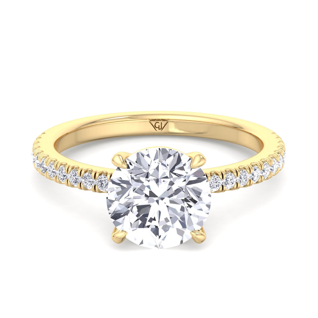 round-cut-diamond-ring-with-sidestones-in-solid-yellow-gold