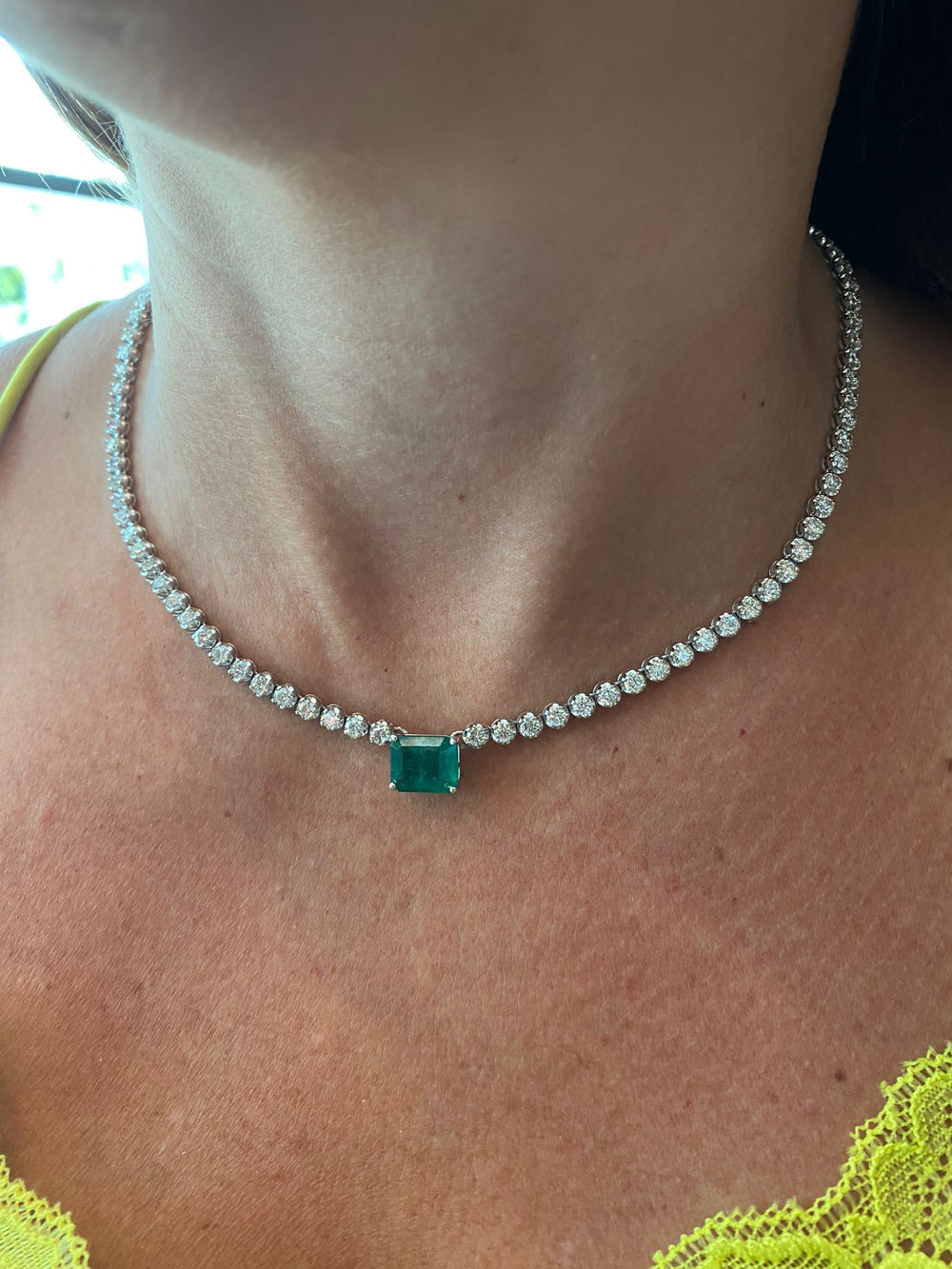 2.50-carat-green-emerald-center-stone-and-8.50-carat-round-cut-diamond-tennis-necklace-in-14k-white-gold