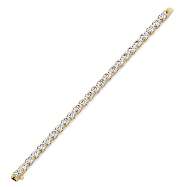 pear-shape-east-to-west-diamond-tennis-bracelet-yellow-gold