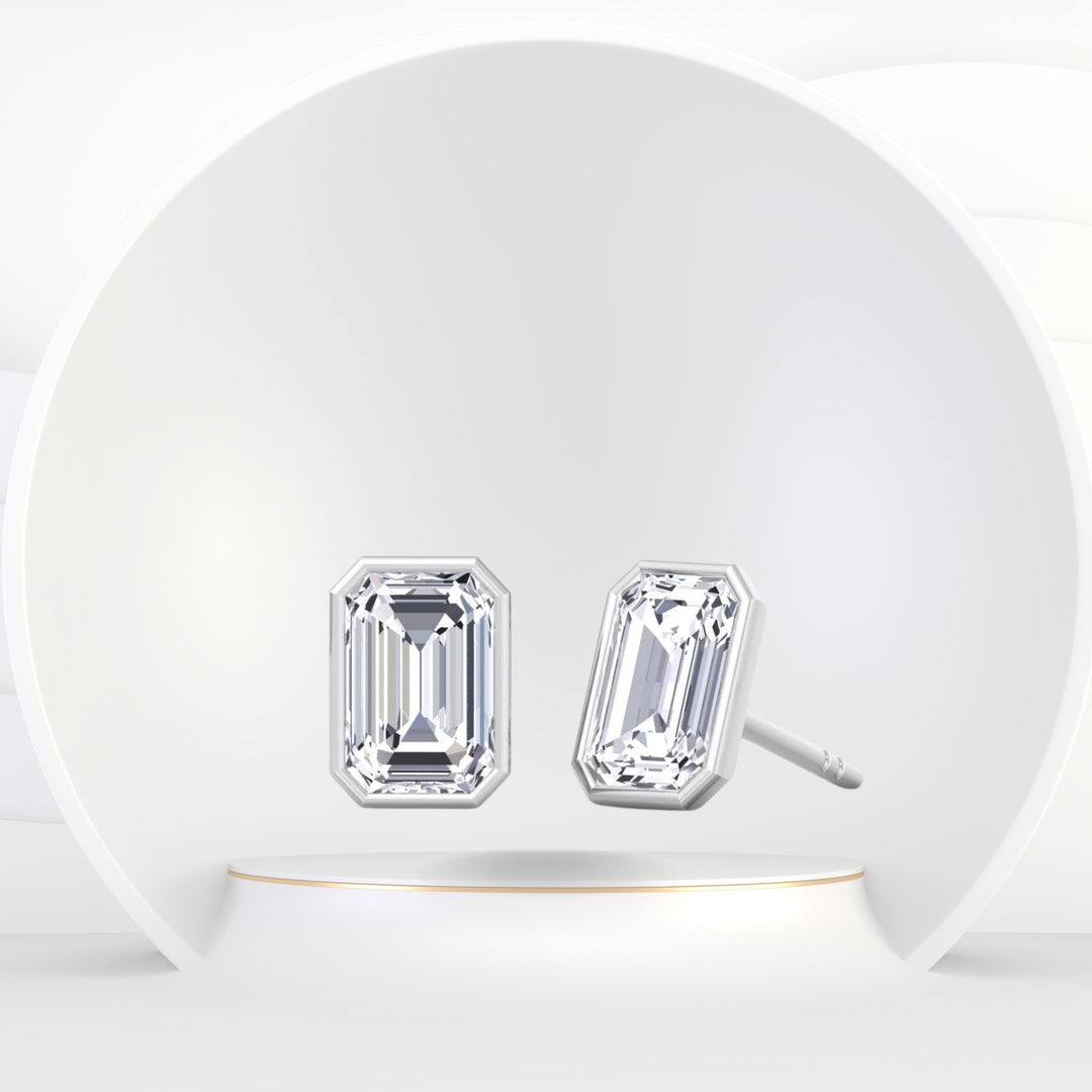 Cheza - Bezel Set Emerald Shape Diamond Studs - Gem Jewelers Co