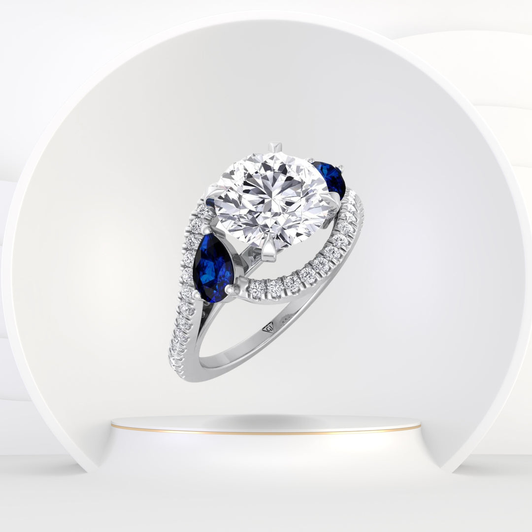 Bora - (2.85CT T.W.) Round Cut Diamond Engagement Ring with Halo & Blue Sapphire Pear Shape Sidestones