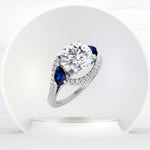 Bora - (2.85CT T.W.) Round Cut Diamond Engagement Ring with Halo & Blue Sapphire Pear Shape Sidestones - Gem Jewelers Co
