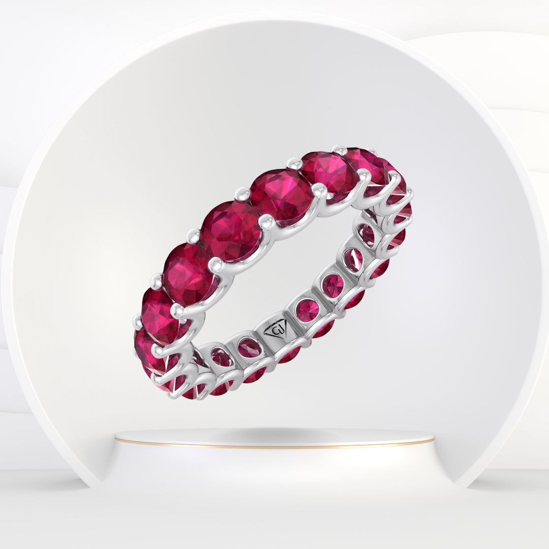 July - Round Cut Red Ruby Eternity Band
