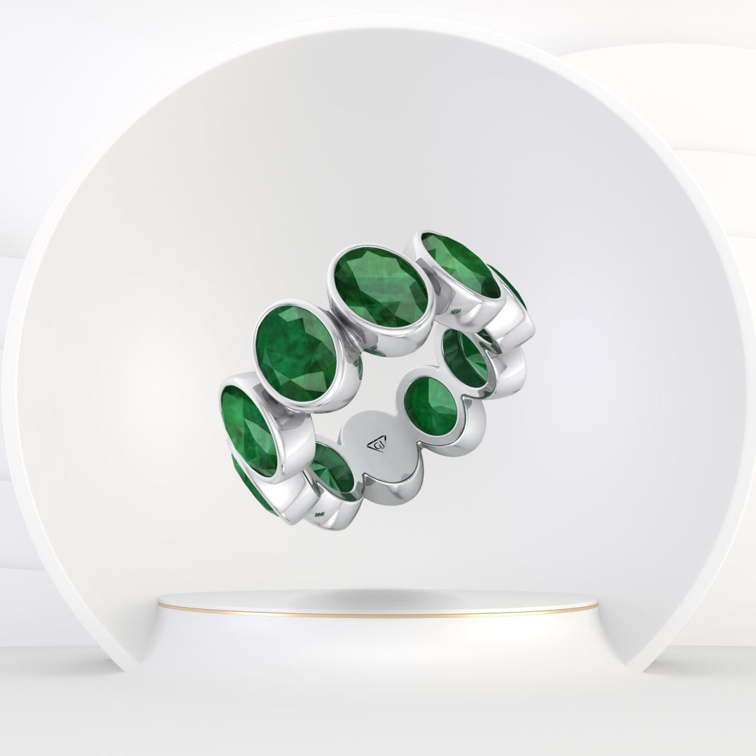 Ophelia - Bezel Set Oval Cut Green Emerald Eternity Band