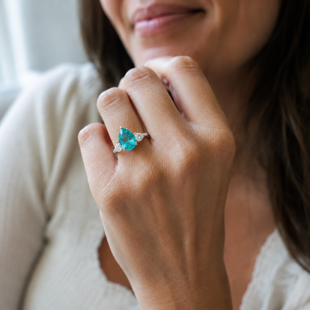 Pear Shape Natural Paraiba Tourmaline Ring with Pear Sidestones  White lifestyle