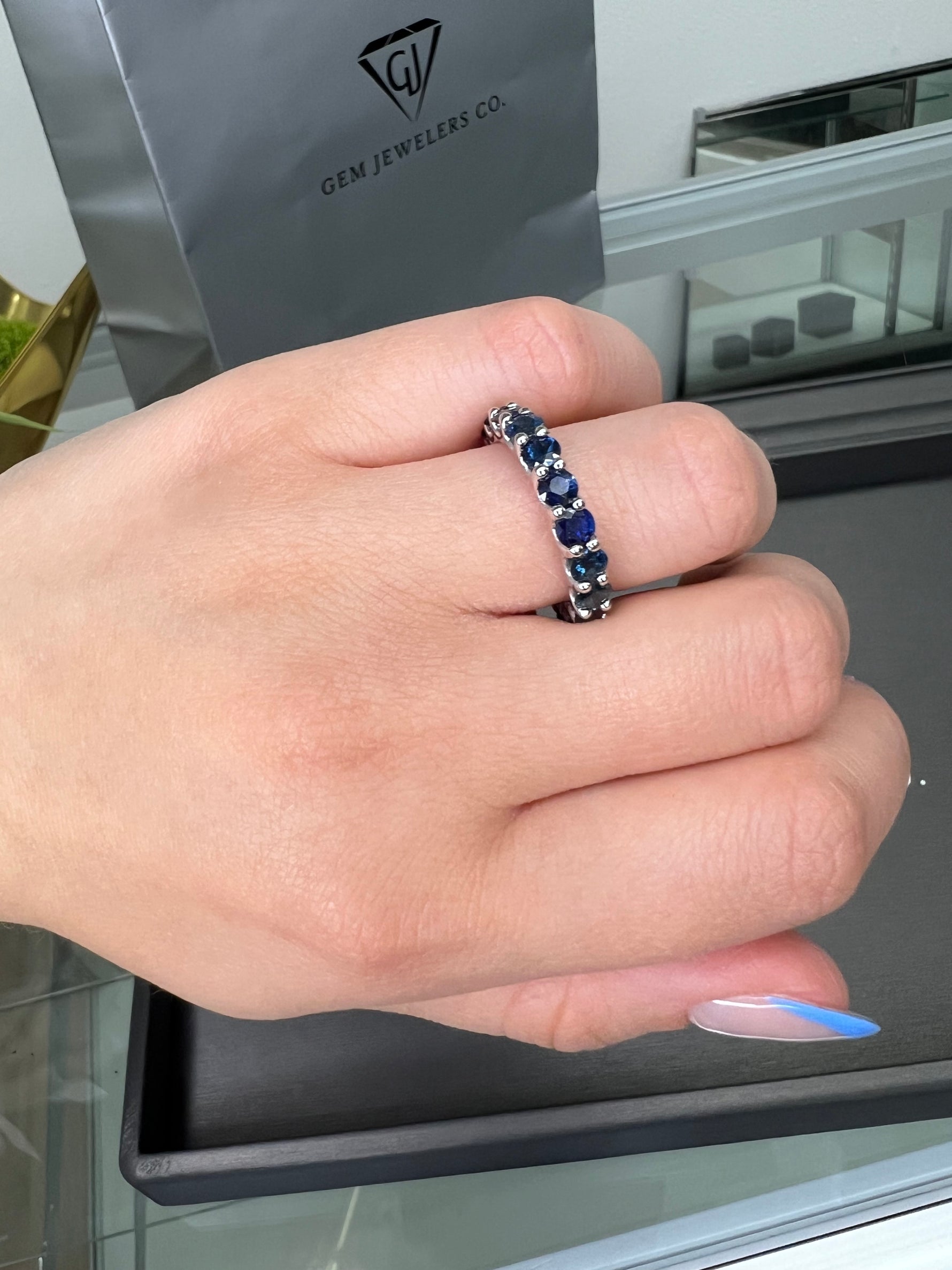  2ct-prong-setting-round-cut-blue-sapphire-eternity-band-14k-white-gold