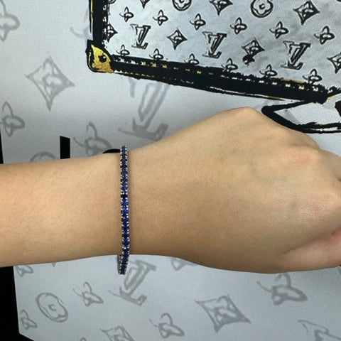 Round cut blue sapphire tennis bracelet 14K white gold