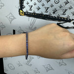 Round cut blue sapphire tennis bracelet 14K white gold