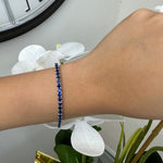 Round cut blue sapphire tennis bracelet 14K white gold