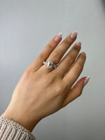 emerald-engagement-ring-with-side-stones-and-invisible-halo-18k-white-gold
