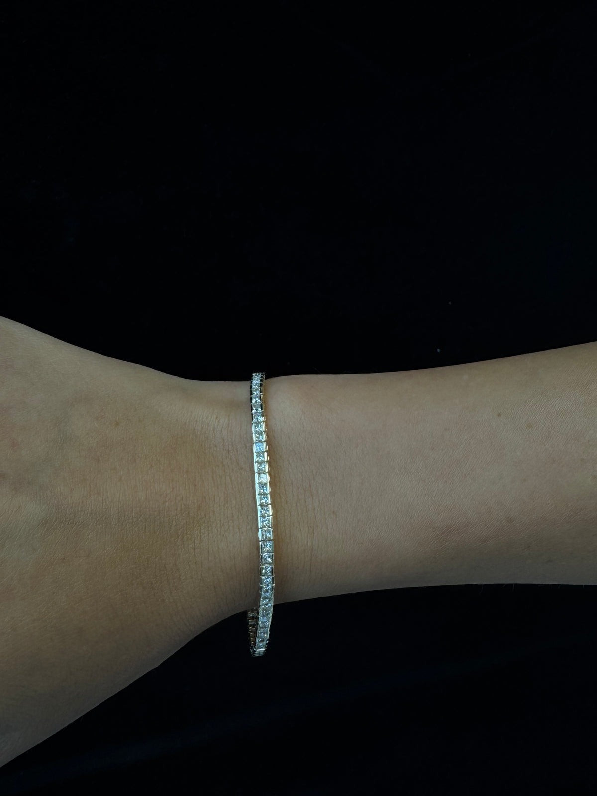 Princess cut natural diamond tennis bracelet with gold setting