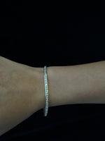 Princess cut natural diamond tennis bracelet with gold setting