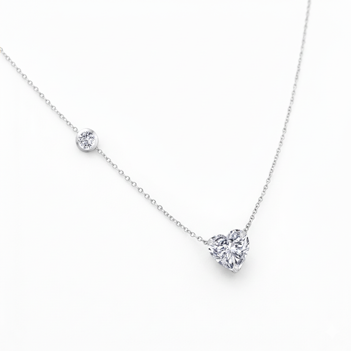 WG Heart Shape With Round Side Stone Natural Diamond Pendant slight side view