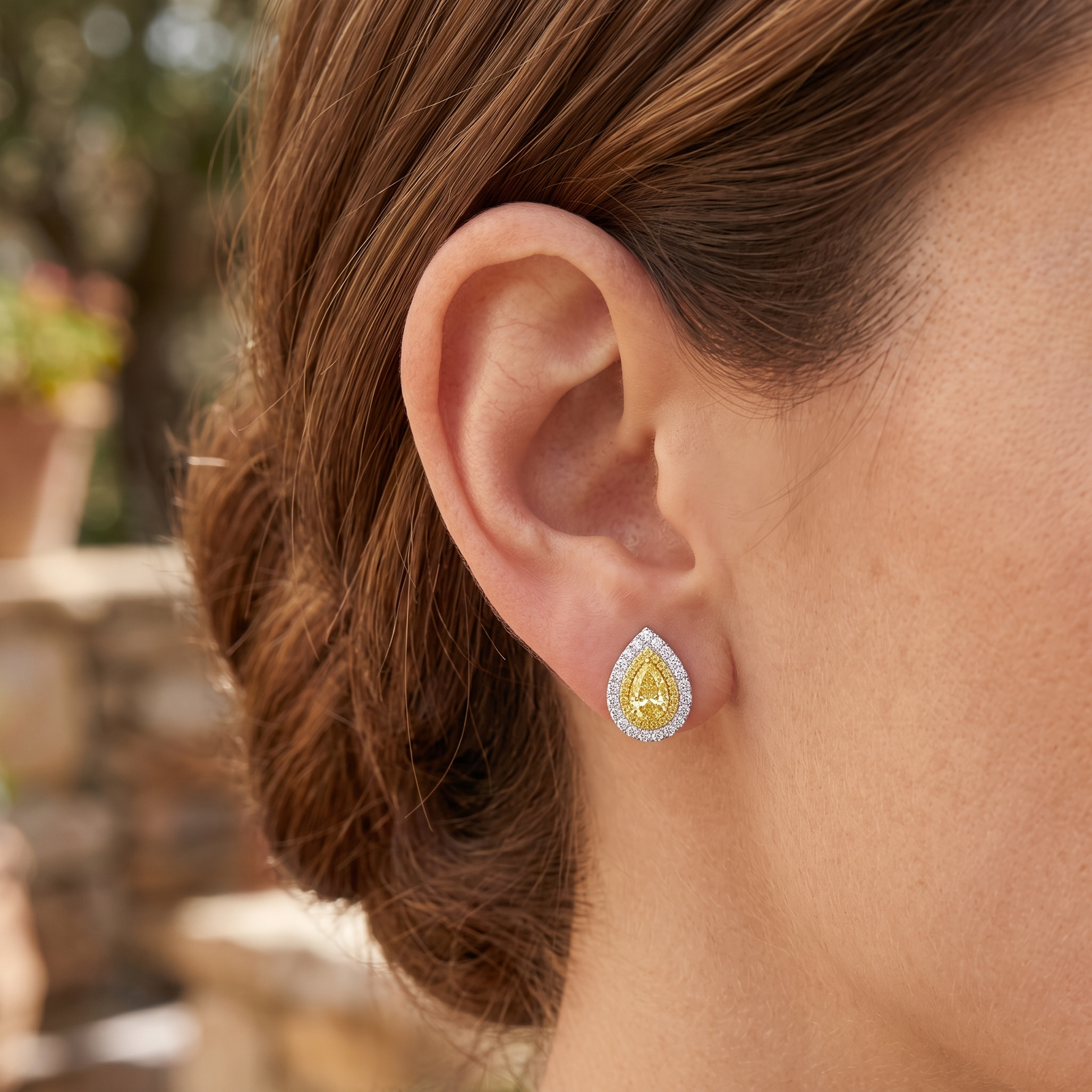 Pear Shape Natural Fancy Yellow Diamond Halo Studs lifestyle WG