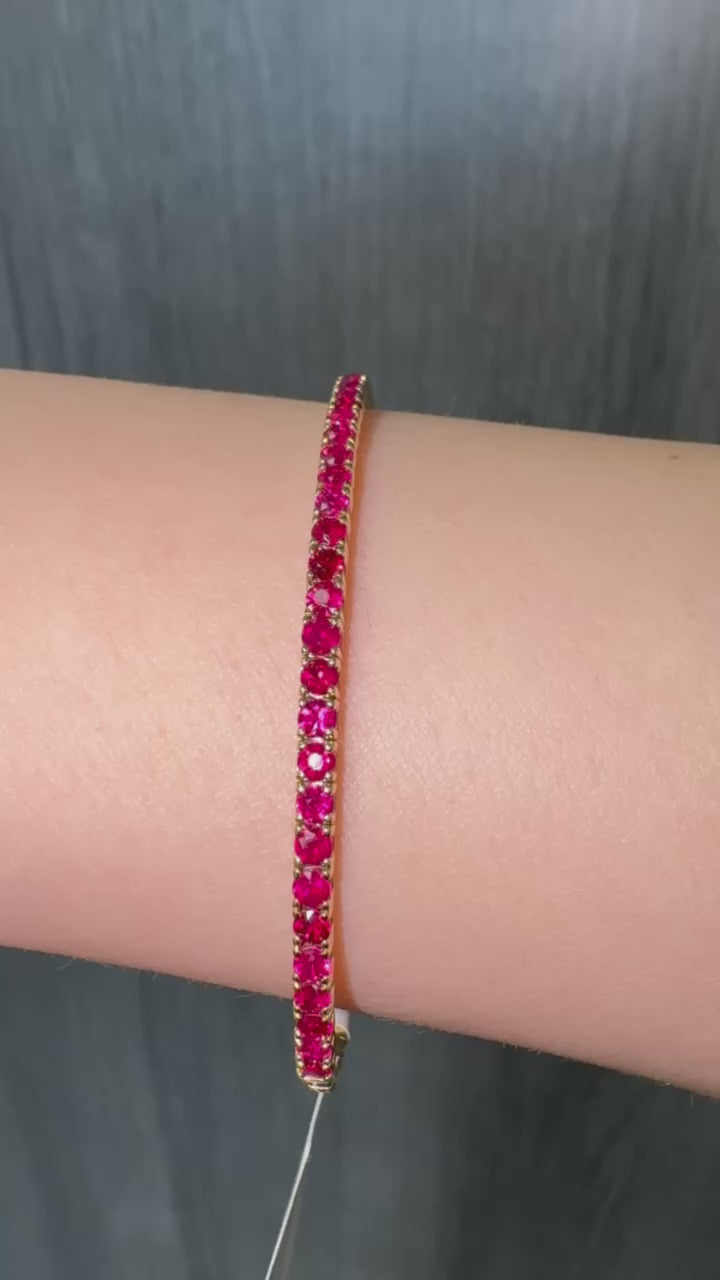 Rossa - Flexible Natural Red Ruby Bangle in 14K Solid Gold - Gem Jewelers Co Lifestyle Video
