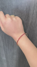 Rossa - Flexible Natural Red Ruby Bangle in 14K Solid Gold - Gem Jewelers Co Lifestyle Video 1