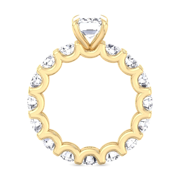 emerald-cut-diamond-eternity-ring-with-round-side-stones-yellow-gold