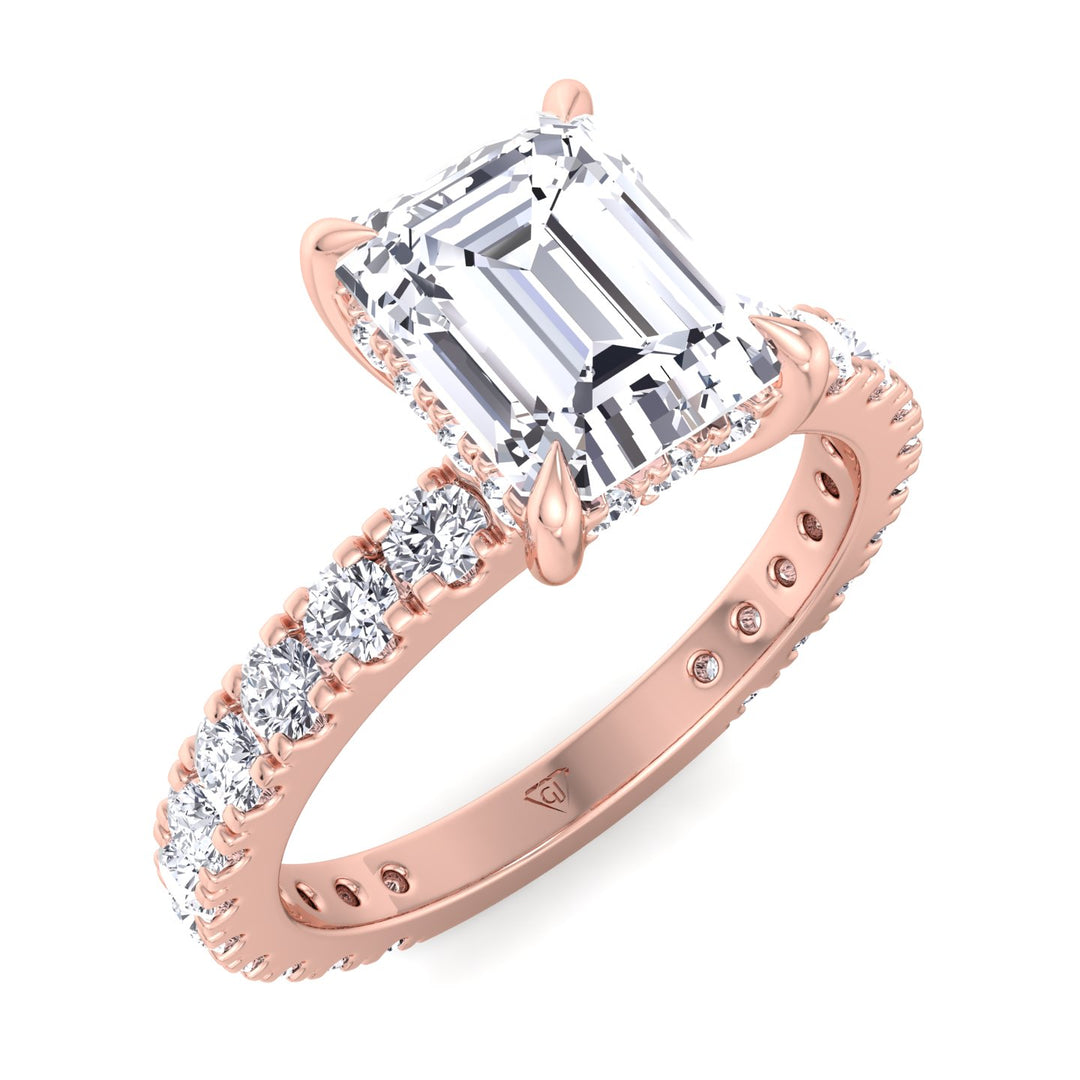emerald-cut-engagement-ring-with-hidden-halo-and-side-stones-in-solid-rose-gold 