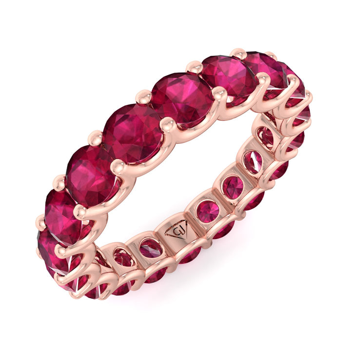 round-cut-red-ruby-eternity-band-in-solid-rose-gold
