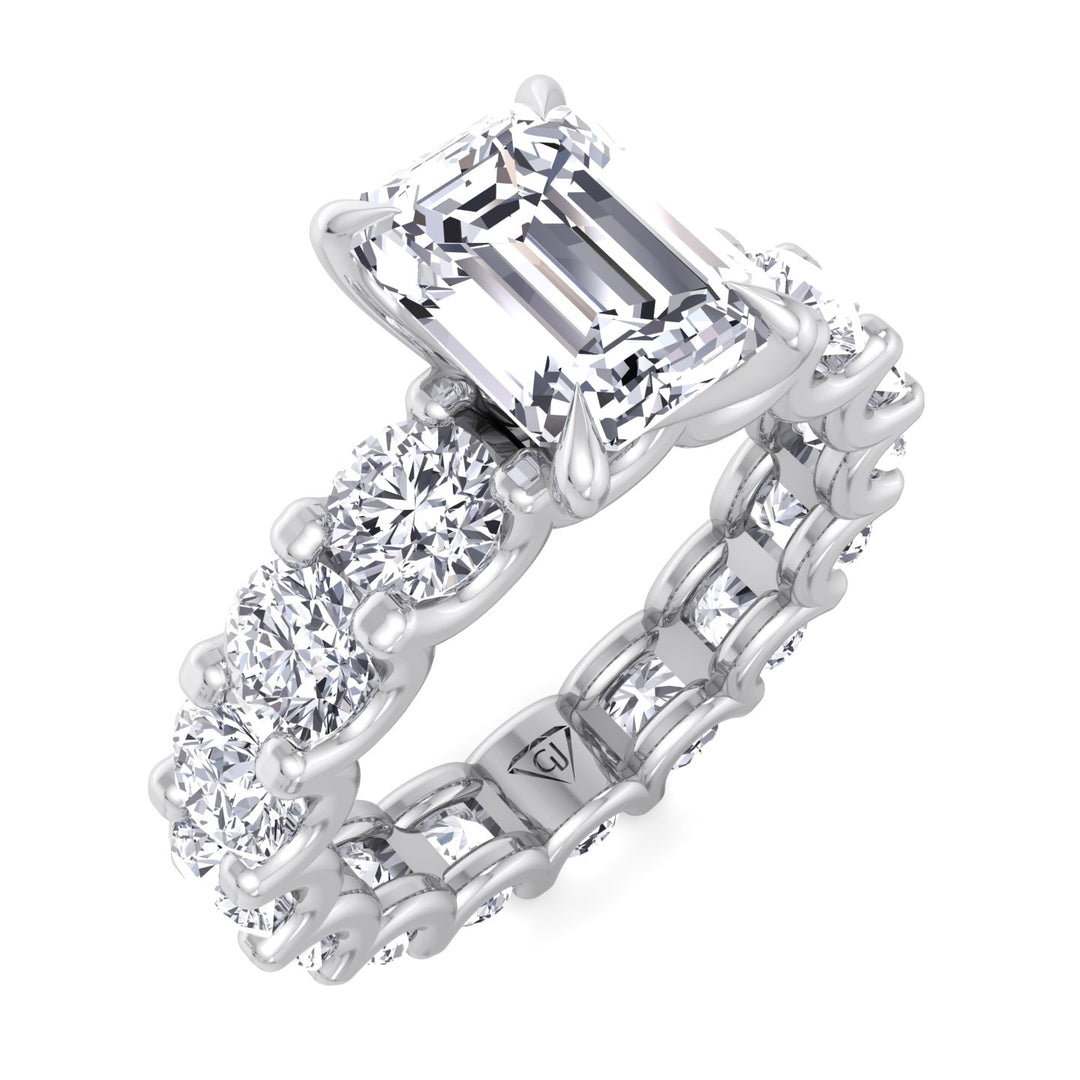 emerald-cut-diamond-eternity-ring-with-round-side-stones-in-solid-white-gold