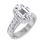 emerald-engagement-ring-with-side-stones-and-invisible-halo-in-solid-white-gold 