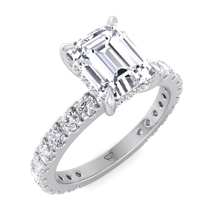 emerald-cut-diamond-engagement-ring-with-hidden-halo-and-side-stones-in-solid-white-gold 