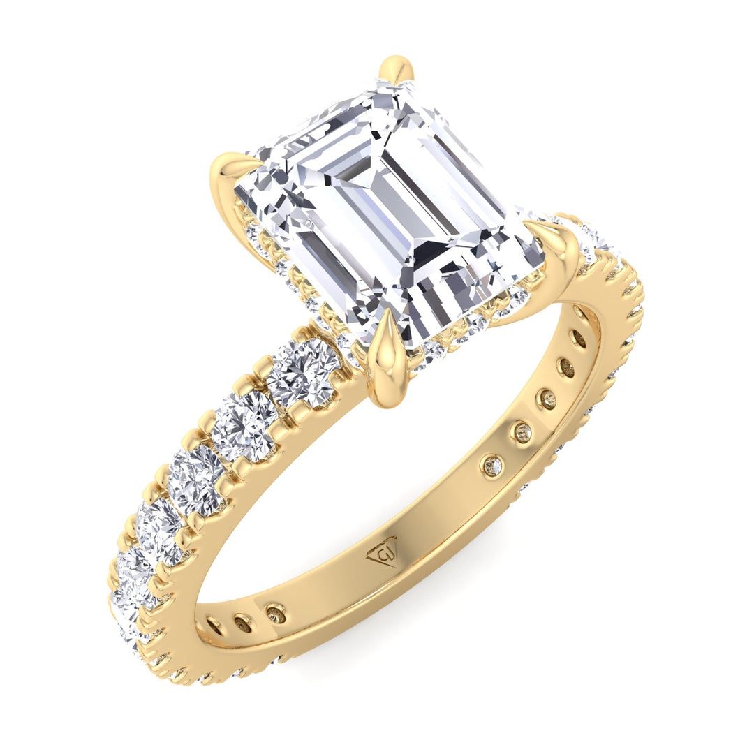 emerald-cut-engagement-ring-with-hidden-halo-and-side-stones-in-solid-yellow-gold 