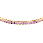 Prong set pink sapphire tennis bracelet yellow gold