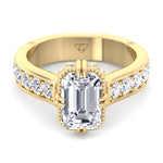emerald-engagement-ring-with-side-stones-and-invisible-halo-in-yellow-gold 