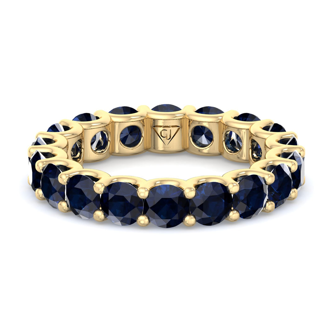  prong-setting-round-cut-blue-sapphire-eternity-band-in-solid-yellow-gold