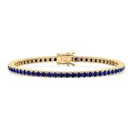4-prong blue sapphire tennis bracelet 14K yellow gold