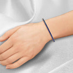 round-cut-blue-sapphire-tennis-bracelet-in-yellow-gold