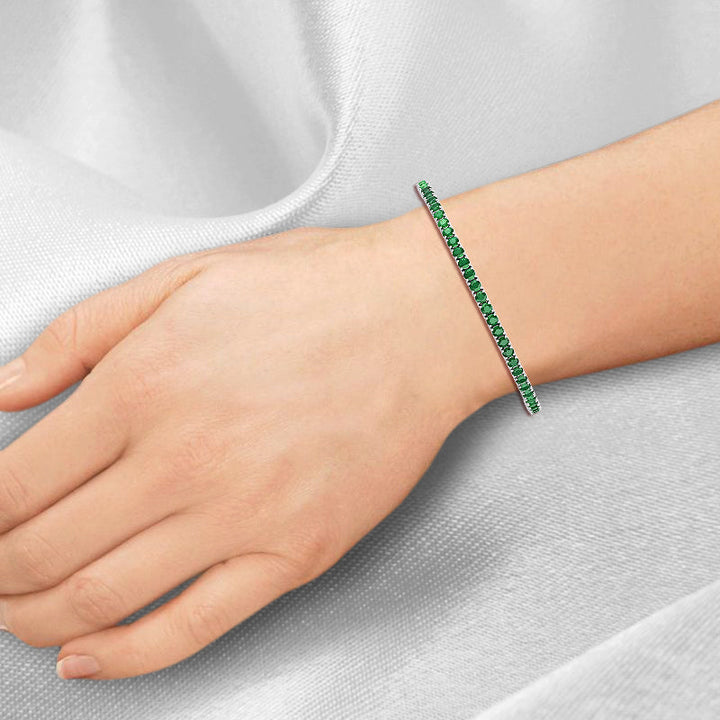 round-cut-7-carat-green-emerald-tennis-bracelet-in-solid-white-gold