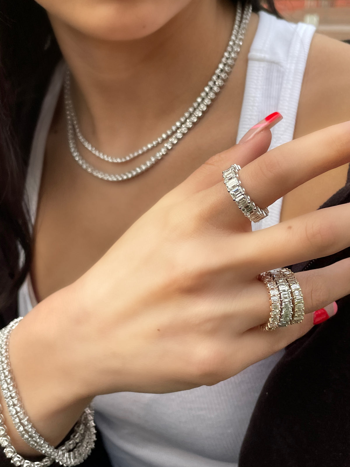 U-prong-emerald-cut-diamond-eternity-band-in-solid-yellow-gold-and-diamond-tennis-necklace-white-gold-and-diamond-tennis-bracelet-in-white-gold