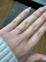 0.25-carat-round-cut-diamond-dainty-band-in-solid-yellow-gold