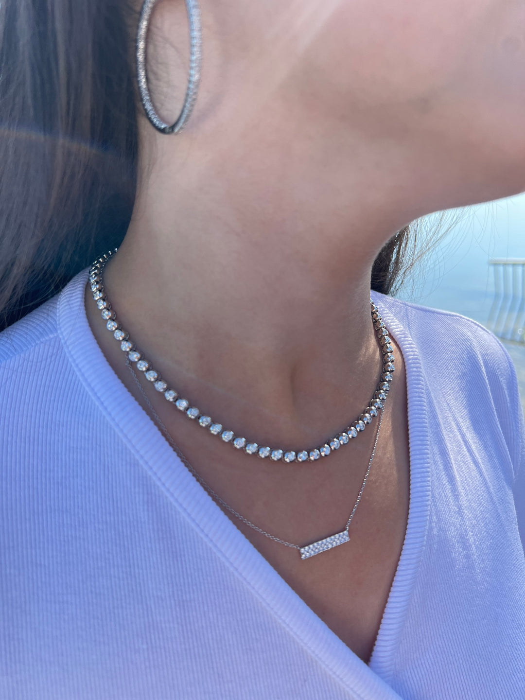 natural-round-cut-diamond-tennis-necklace-set-in-a-bezel setting-in-18k-white-gold-and-a-diamond-bar-pendant 