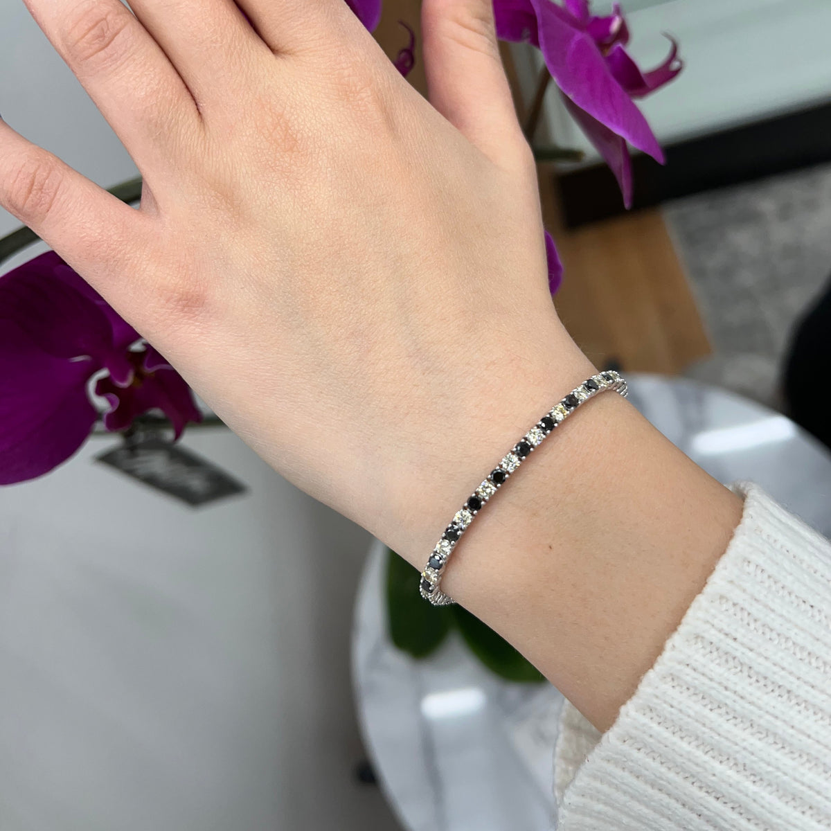 Round cut black and white diamond tennis bracelet 14K white gold