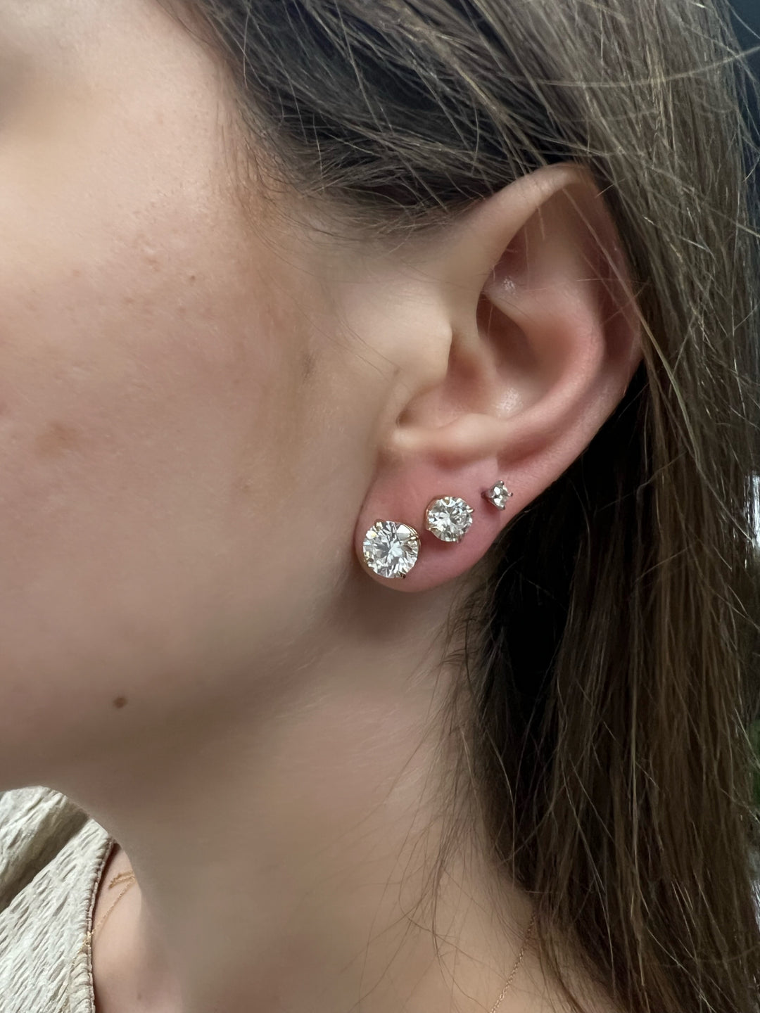 round-cut-classic-diamond-studs-in-a-row-multiple-piercings