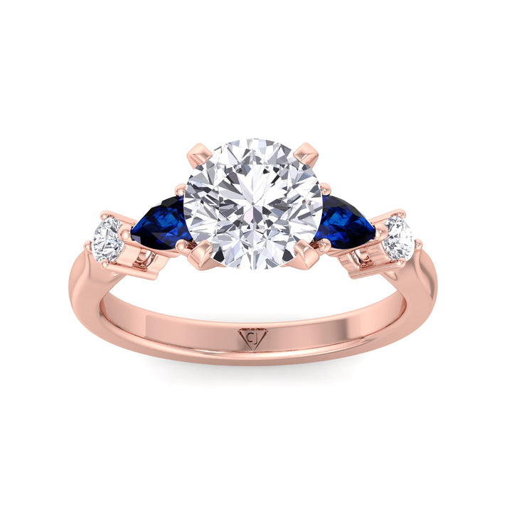 2.57ct-t-w-round-cut-diamond-engagement-ring-with-blue-sapphire-pear-shape-sidestones-in-solid-rose-gold